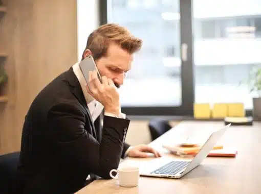 man on phone at desk