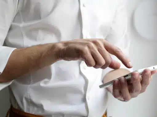 hand touching a phone