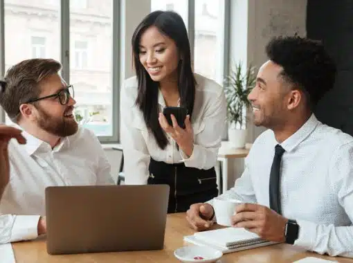 three people working in an office