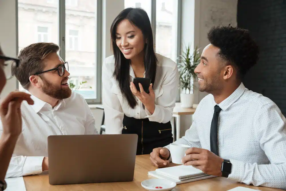 three people working in an office