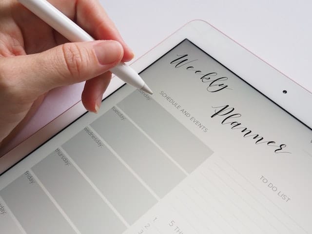 hand writing on tablet with stylus