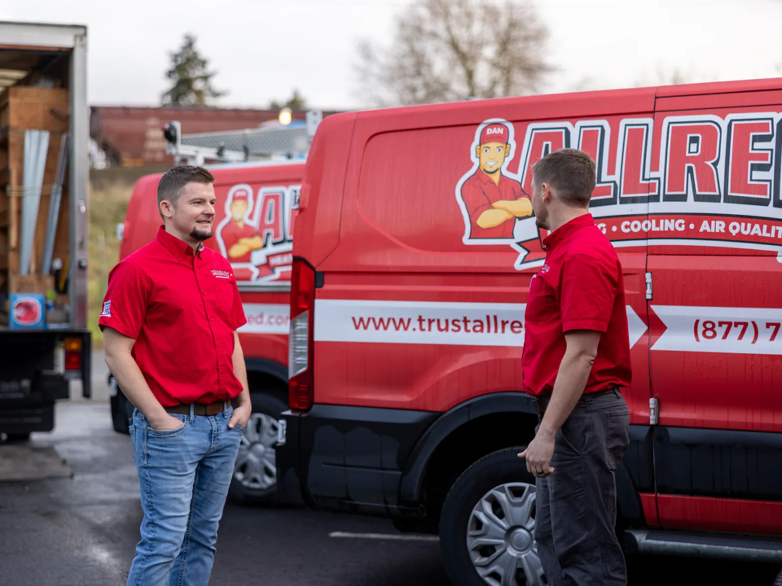 Founders Matt and Dan Allred by an Allred service van
