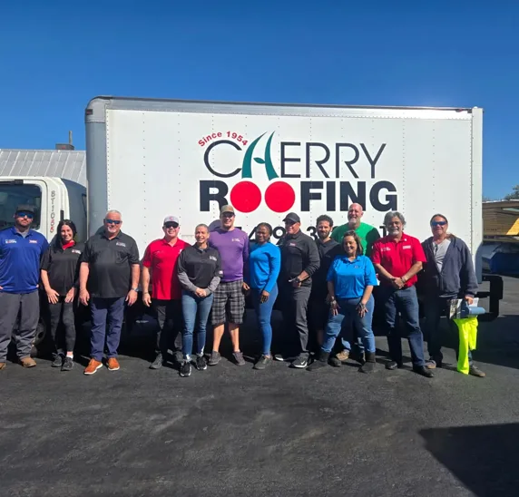 Cherry Roofing team in front of a branded company truck