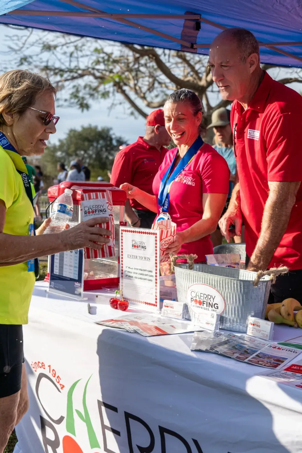 Cherry Roofing team speaking with a visitor at an event