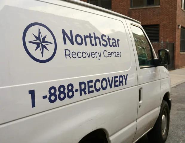 Recovery center van with vanity phone number displayed