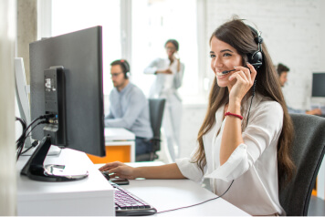 woman on headset at desk