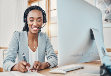 woman with headset at desk